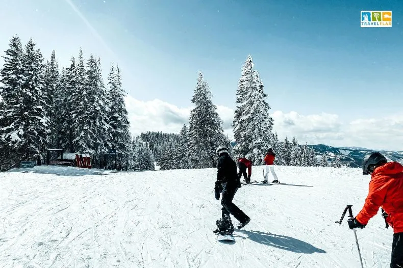 People Snowboarding and Skiing on Slope in Colorado