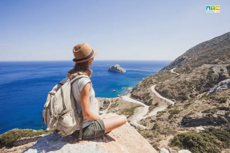 Young woman traveler, enjoying nature